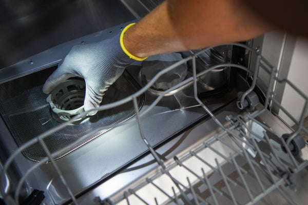 maintenance on the inside of a dishwasher